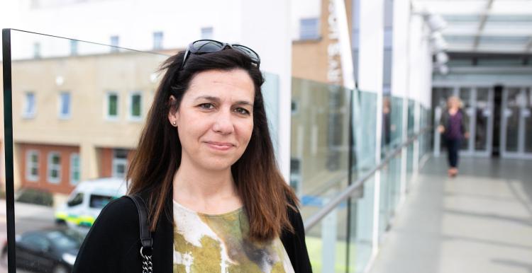 A woman outside a hospital